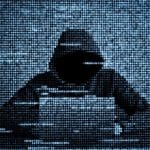 Hacker with computer symbolizing cyberattacks against Tech Service Providers, Microsoft Okta Lapsus$