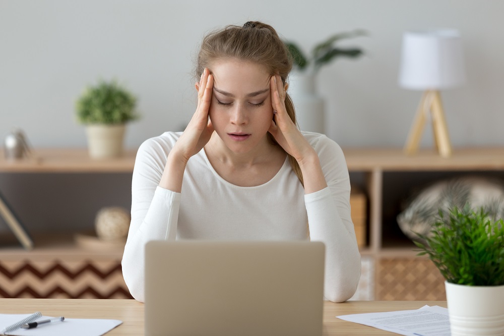 woman overwhelmed with work tasks