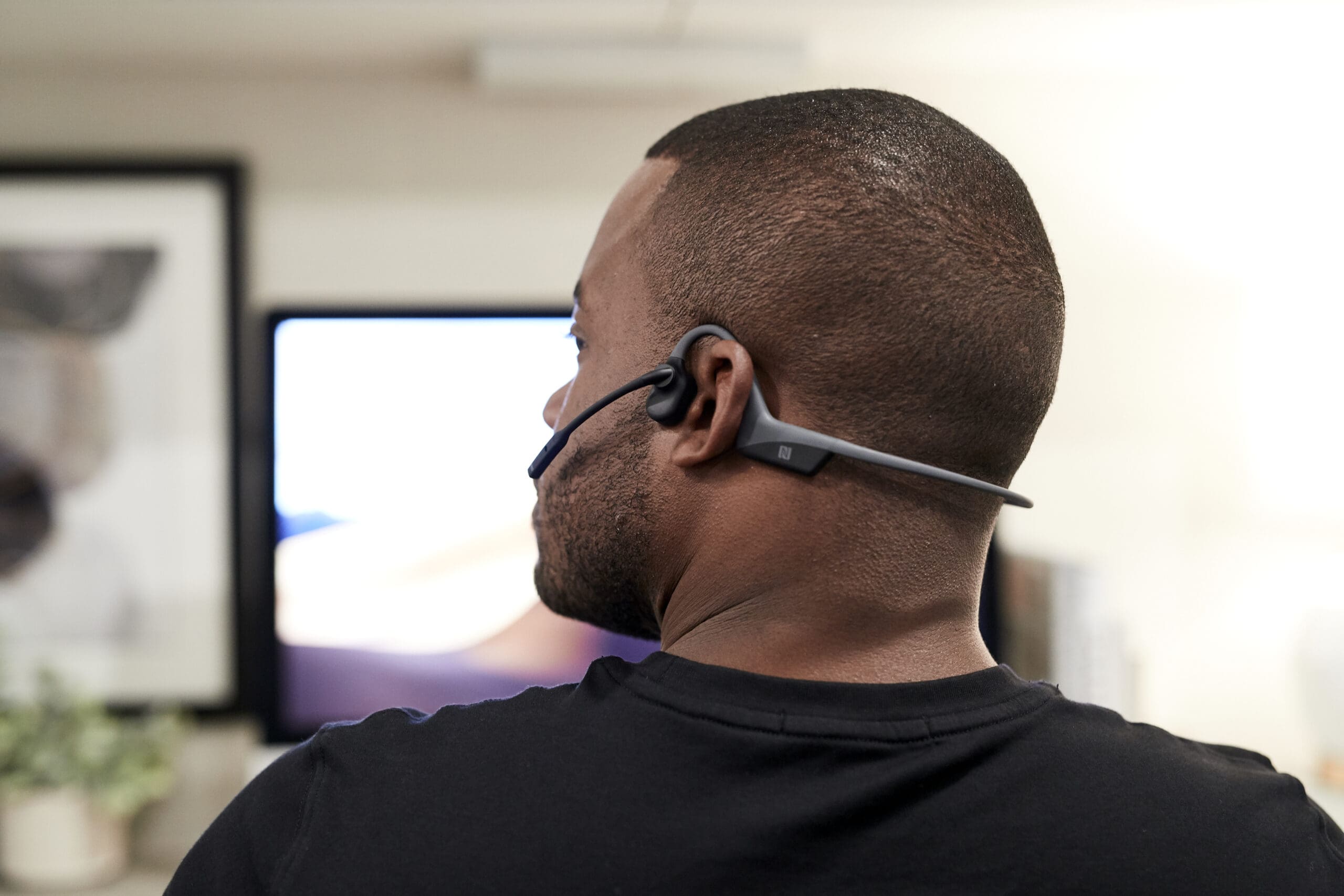 Person wearing OpenComm UC headset