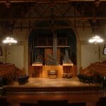 Music Hall that is dimly lit with warm overhead lights