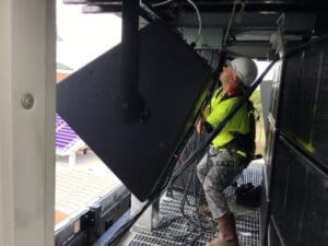 Person fixing a video display