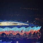 View of the Olympic Sports Center lit up at night