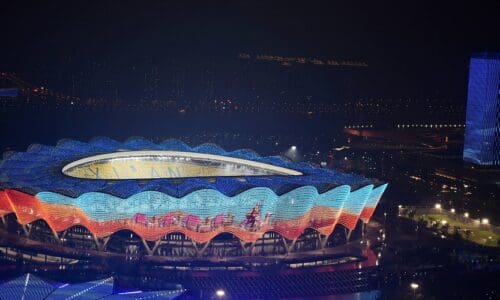 View of the Olympic Sports Center lit up at night