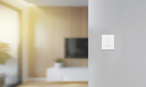 Blurred room with wall in forefront. A WAKE Amp is fitted on the wall