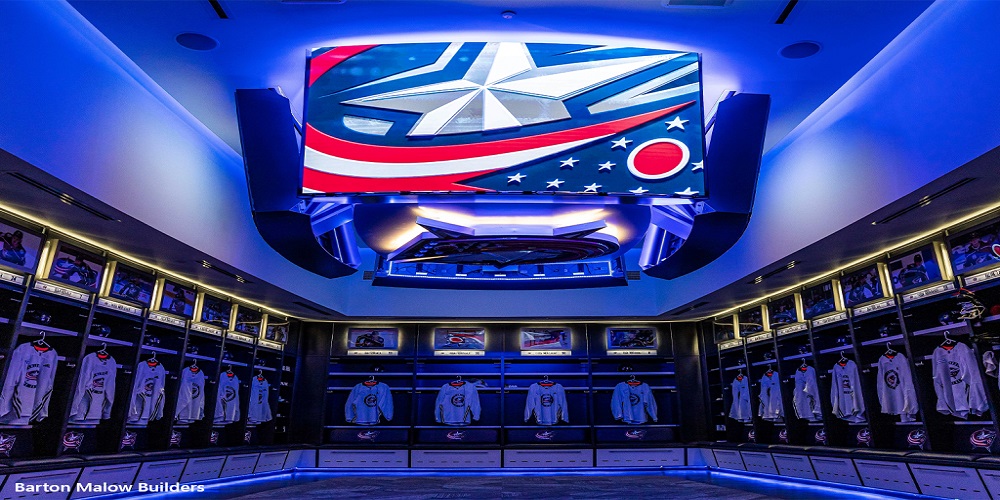 The SNA Displays center-hung feature hanging in the locker room. The screen has a display of the Blue Jackets logo