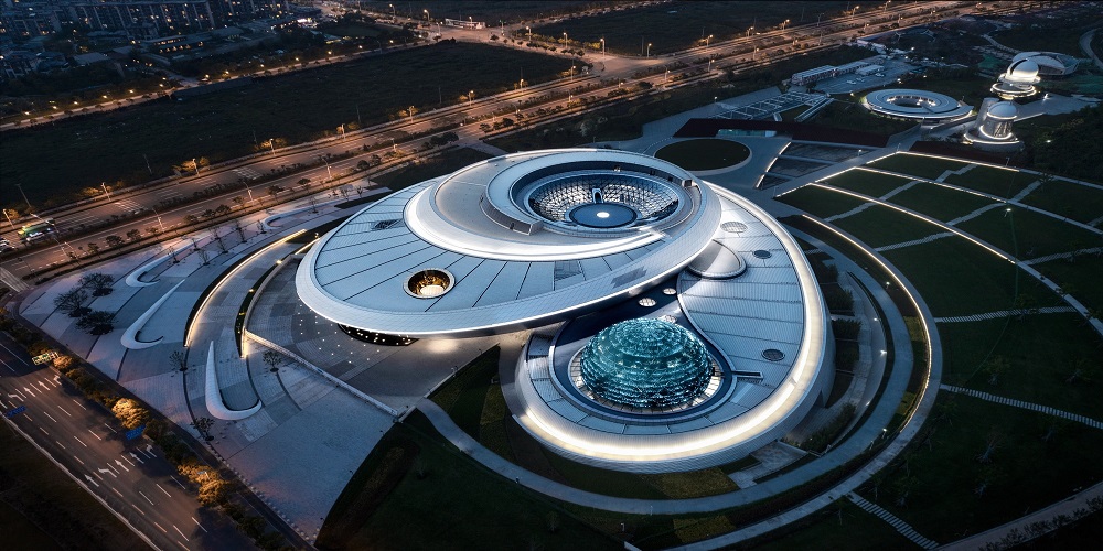 Aerial view of the Shanghai Astronomy Museum at night.