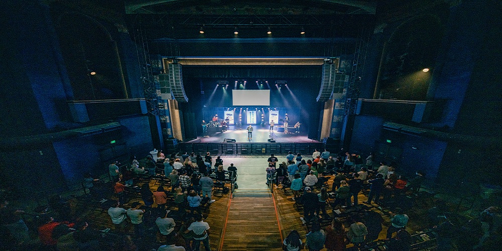 Vox Church stage with people on the podium