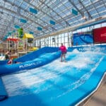 Person sliding down a water slide.