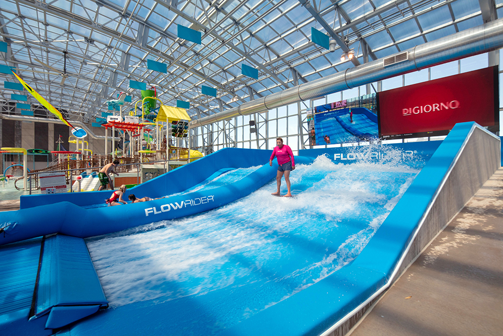 Person sliding down a water slide.