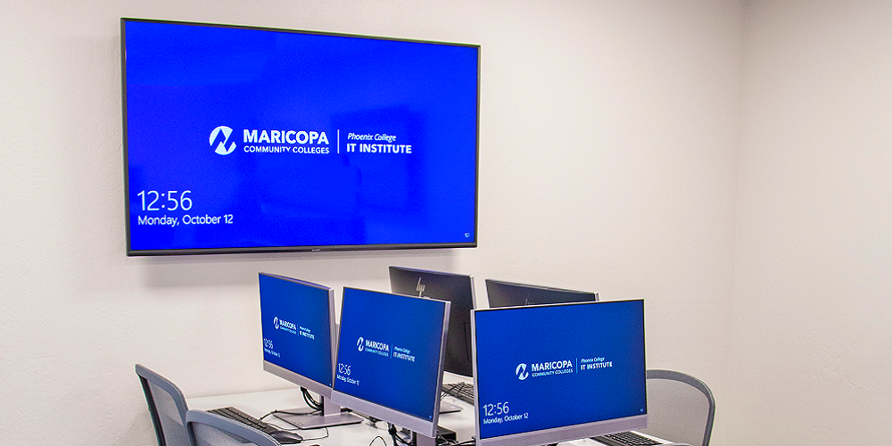 Extron screens displaying the words: Maricopa Community Colleges | Phoenix College IT Institute