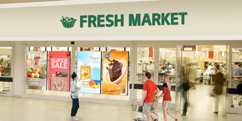 Rendering of LG 75XS4G brightness displays outside a grocery store window.