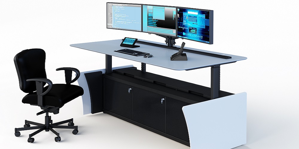 Chair and desk setup by Winsted and Concept Seating. On the desk are two monitors with a keyboard.