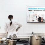 Rendering of UPshow SHIFT on a screen next to a cook working in a kitchen.