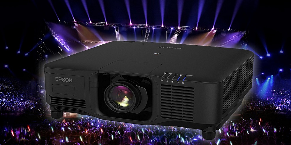 Epson Pro Series projector against a concert backdrop.