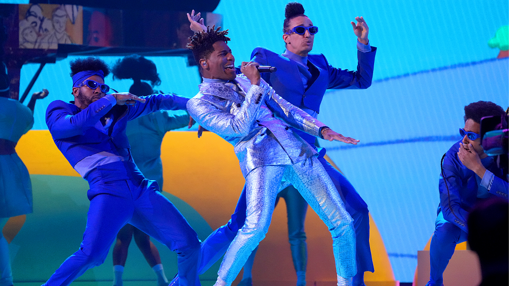 Jon Batiste performing with a Shure microphone at the 64th GRAMMY Awards.