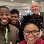 Alesia Hendley taking a selfie with Exertis Almo E4 Chicago attendees.