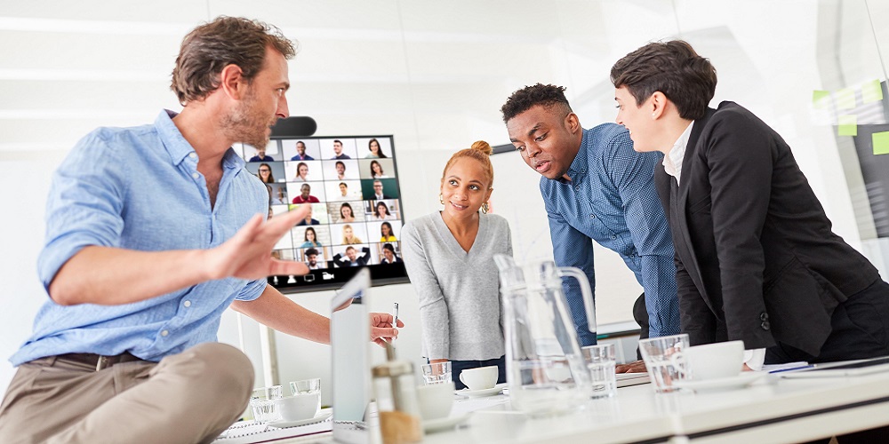 Business start-up team and consultants in the office at the conference table during coaching