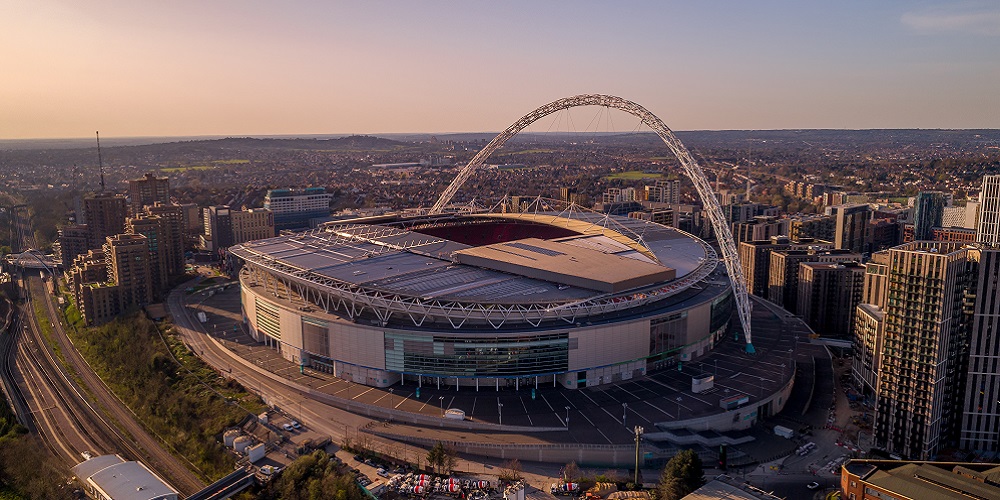 Aerial view of Wembley Stadium at dusk.