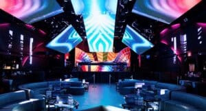 Inside the NEBULA, a room is lit up in blue techno lights.
