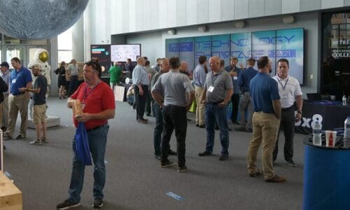 People interacting at booths during Pearl Technology Inaugural Showcase