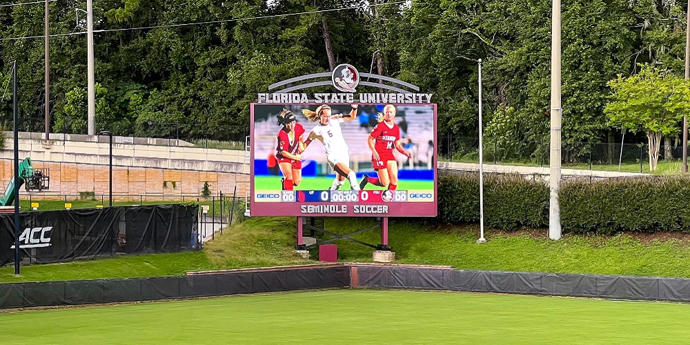 Video scoreboard featuring FSU soccer team.