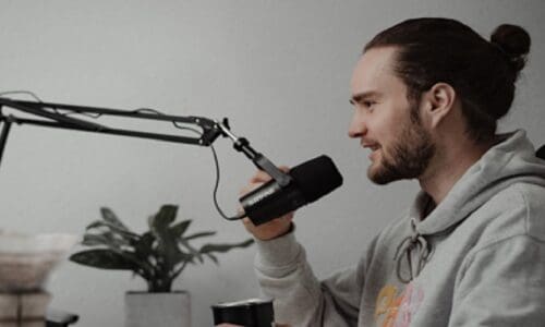 Person speaking into Shure MV7 microphone.