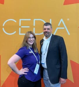 Brittany DiCesare and Steven Greenblatt posing for CEDIA Expo.