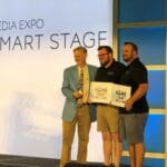 Jason Knott presenting an award onstage at CEDIA Expo
