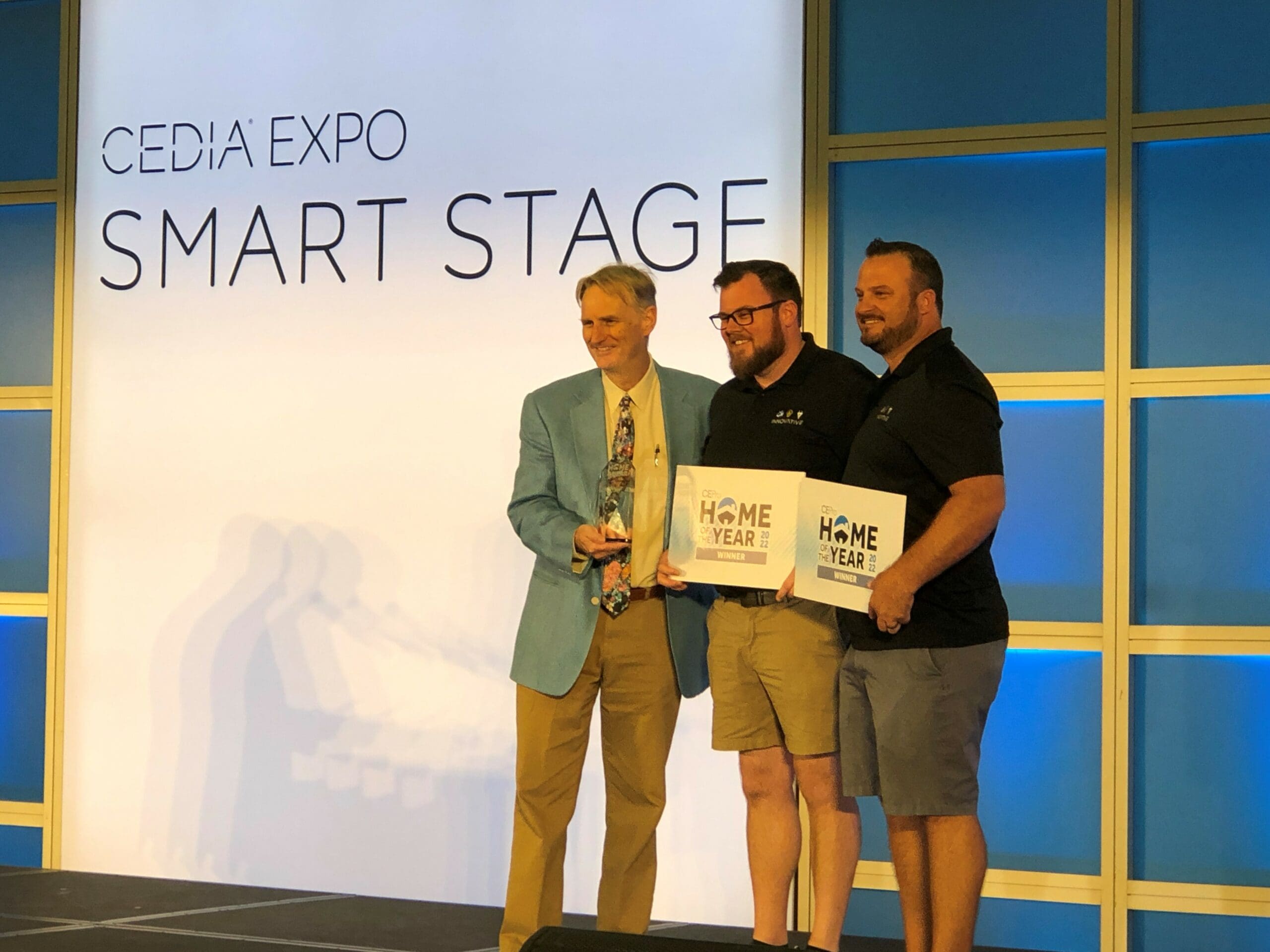 Jason Knott presenting an award onstage at CEDIA Expo