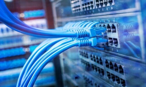 Blue ethernet cables fitted onto a network to represent PoE.