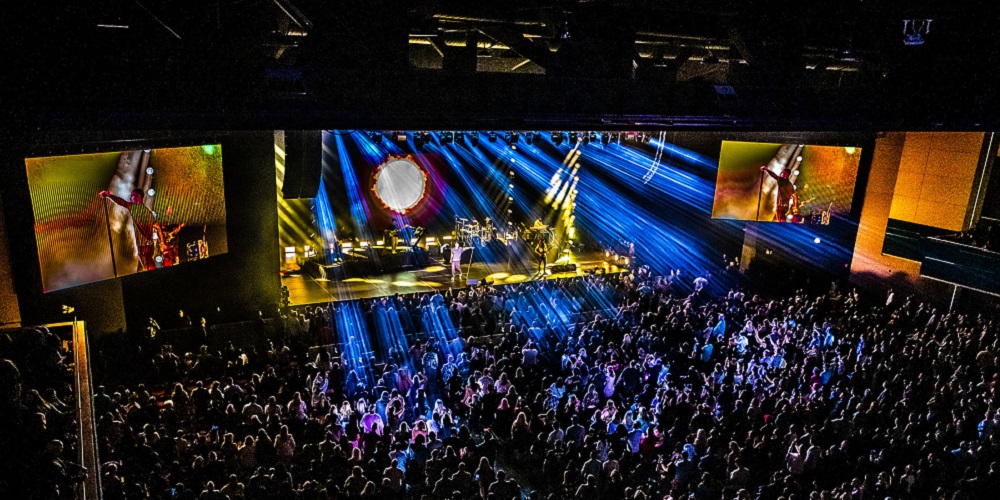 Hard Rock Live venue packed with audience dancing to performers onstage.