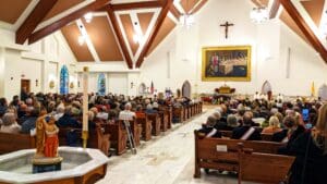 Audience attending Mass at Most Holy Trinity Church.