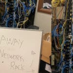 tangled wire rack with sign that says stay away as an example of best #AVFail.