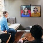 People in a conference room using HP & Poly devices certified for Microsoft Teams.