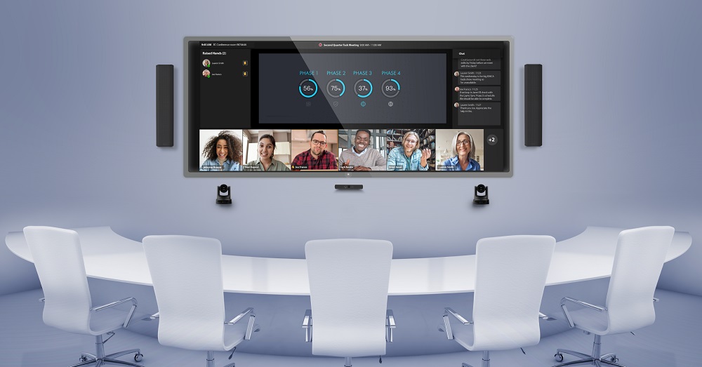 Q-SYS system with Microsoft Teams Rooms displayed on a screen in a conference room.