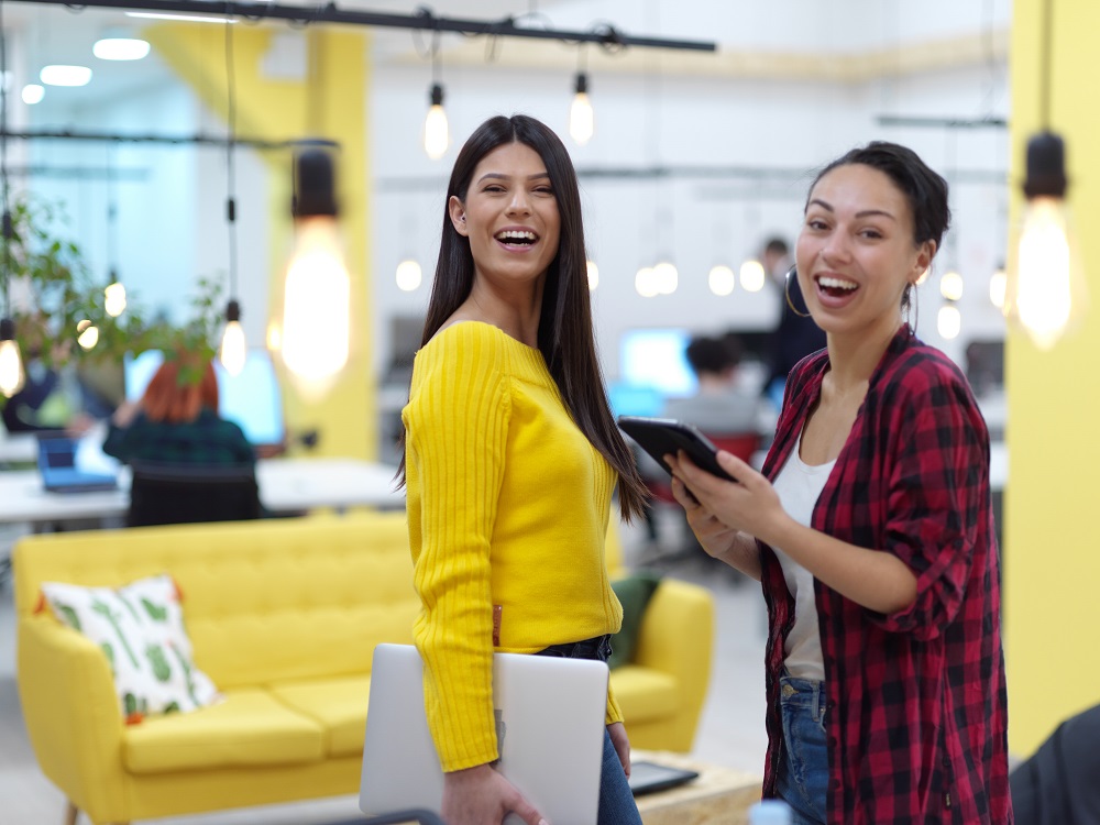 female friends discussion about project at moder coworking office