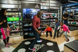 family playing in Adidas Store