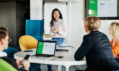 women talking with colleagues in meeting