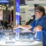 Two people discussing the resimercial market on the show floor.