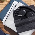 Jabra Evolve2 headset in a pouch on a coffee table.