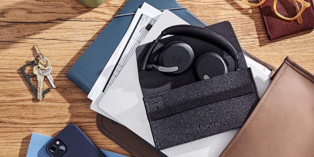 Jabra Evolve2 headset in a pouch on a coffee table.