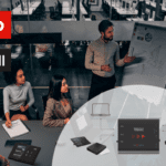 People in a conferencing room with the logos of Lenovo and INOGENI placed on the upper-left corner.