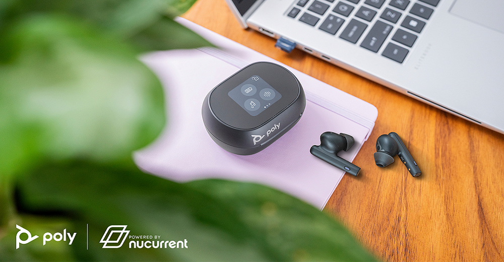 The Voyager Free 60 Series earbuds by Poly and powered by NuCurrent placed near a desktop.