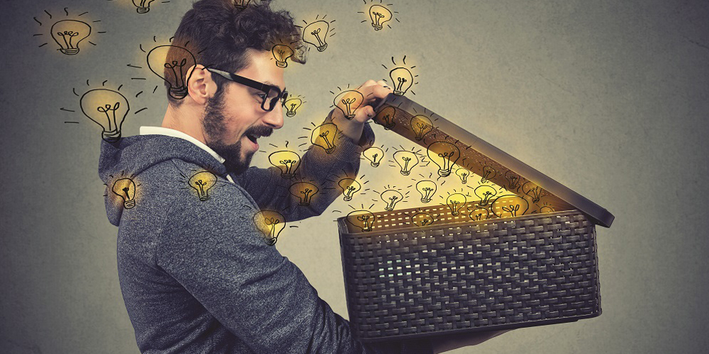 man opening a box with many bright light bulbs