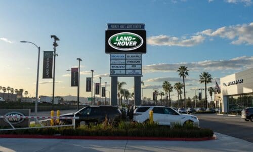 Digital billboard featuring SNA Displays LED technology, showcasing Land Rover logos for customers.