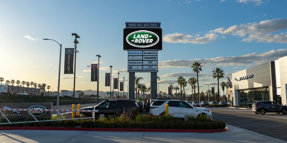 Digital billboard featuring SNA Displays LED technology, showcasing Land Rover logos for customers.