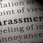 Harassment highlighted in dictionary.