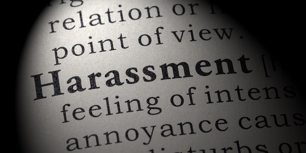 Harassment highlighted in dictionary.