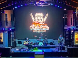 Route 66 logo on videowall behind stage.