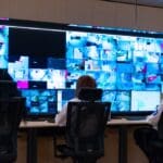 control room, Team of secret agents in uniforms, monitoring cyber, video and communications at the main control data center station.